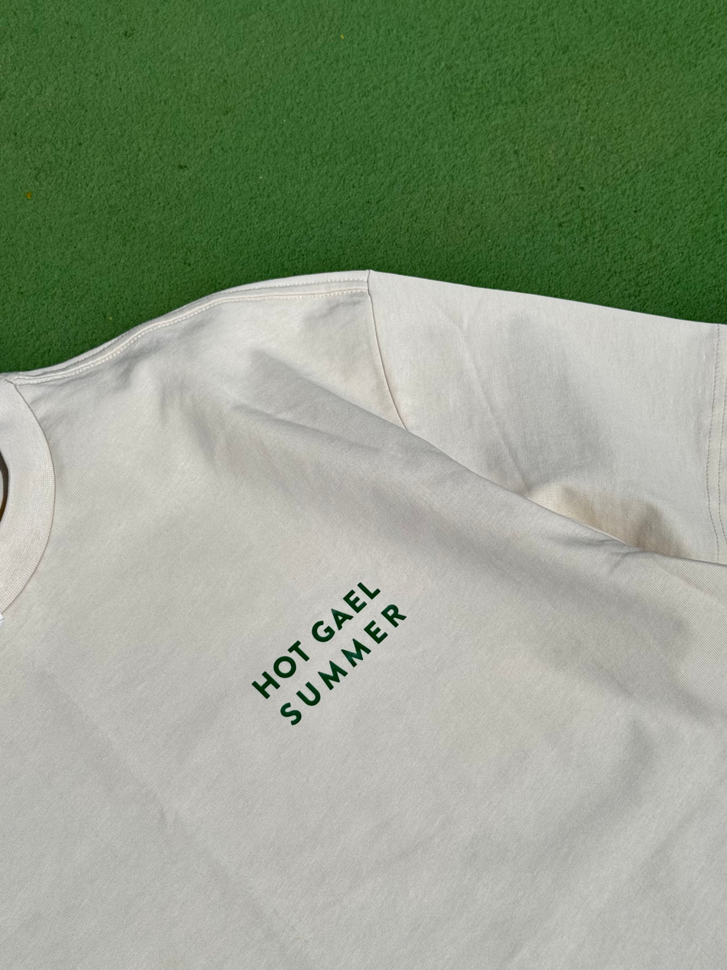 Cream sleeveless shirt with 'HOT GAEL SUMMER' text on a green background